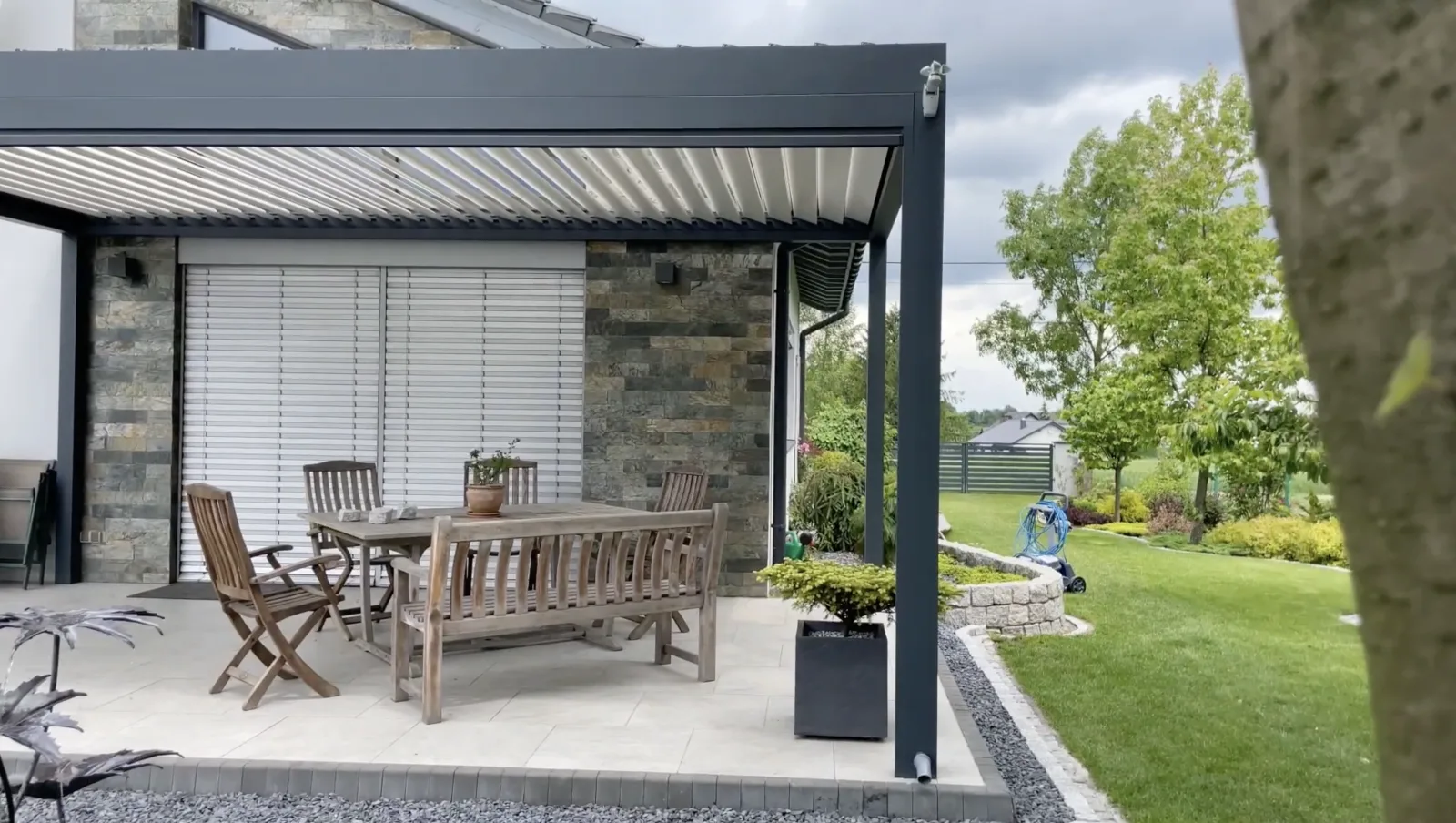 Modern outdoor lounge pergola with bar setup and entertainment area - professional Dublin installation